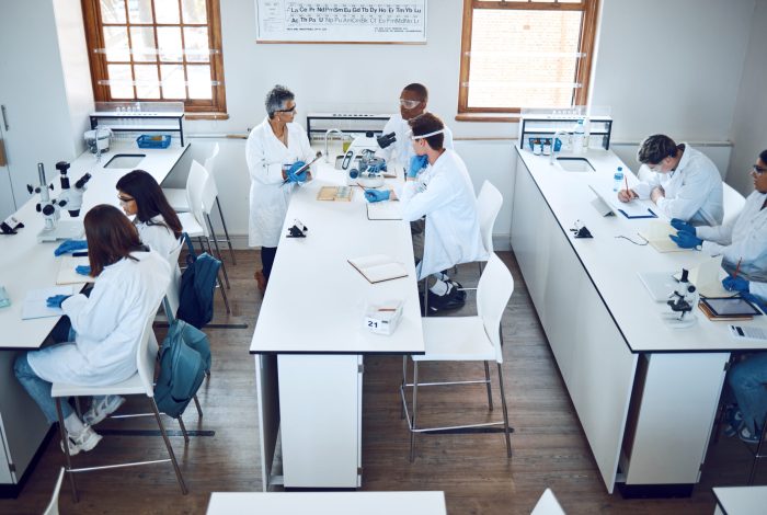 Laboratories & RD1 Education, science and students in lab classroom with professor and equipment for test. Technology,.